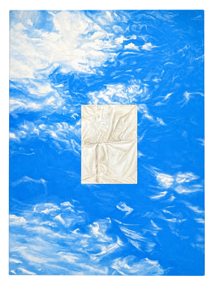 Wisps of white cross a blue sky, interrupted by a pale folded rectangle at the centre.
